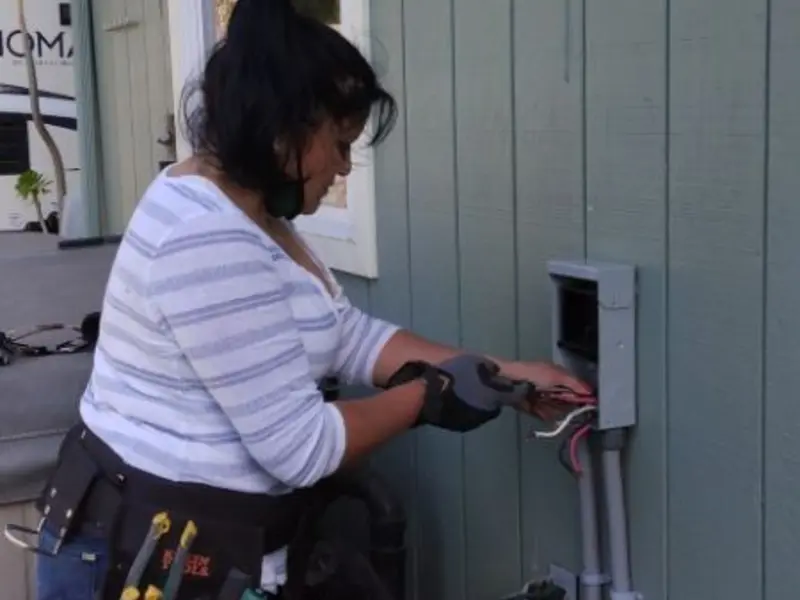 Licensed electrician wiring an exterior subpanel in Vandenberg Village