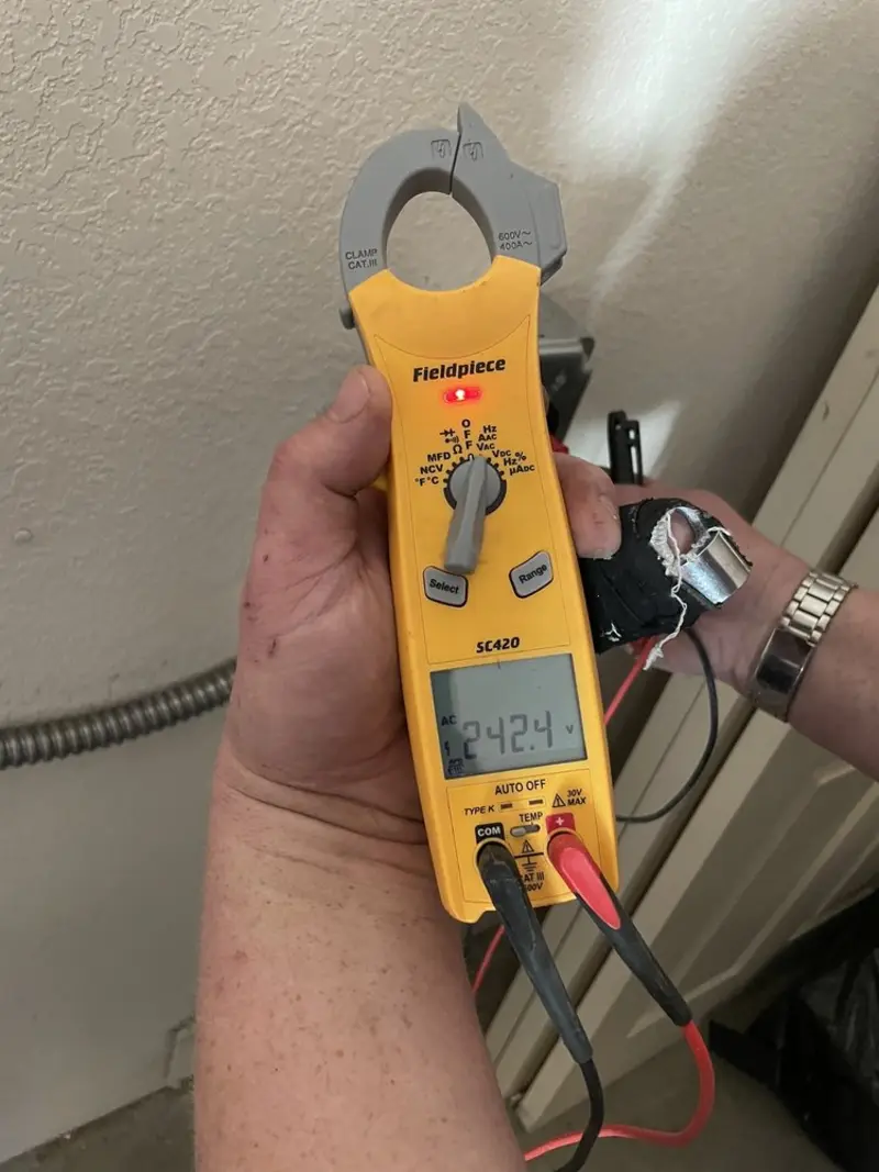 Voltage testing with clamp meter during Outlet Installation in Vandenberg Village